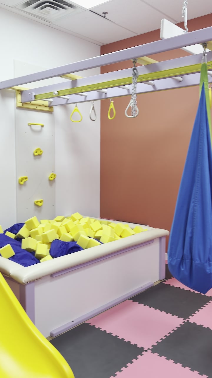 Padded foam pit and hanging equipment in our sensory gym