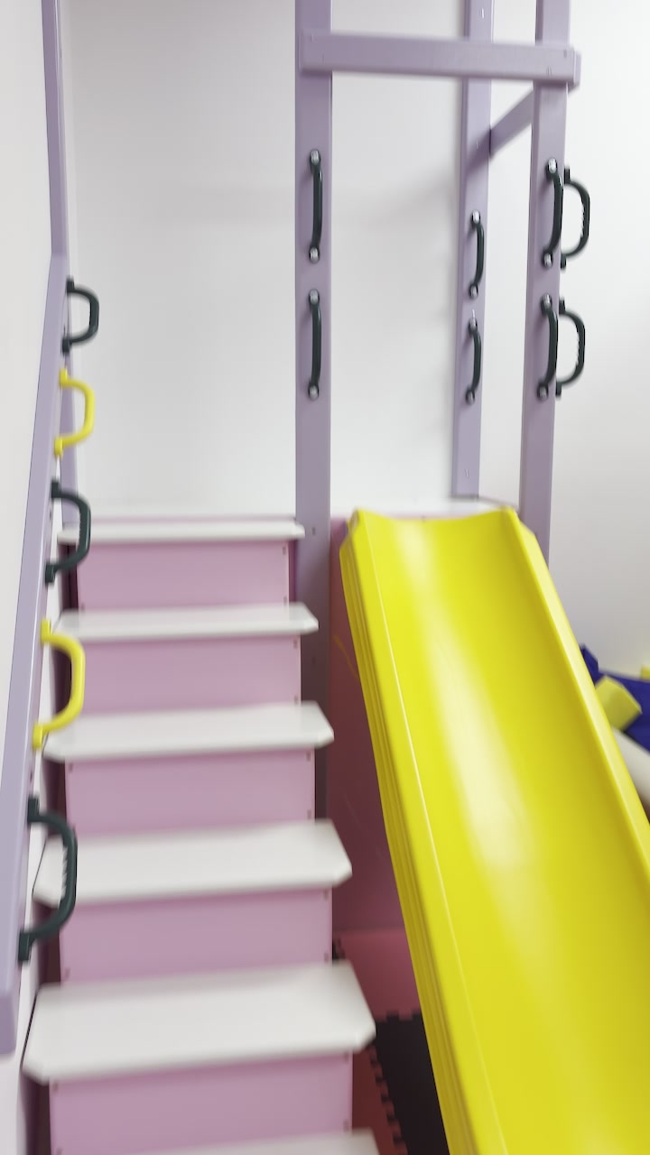 Yellow slide and steps in our sensory gym