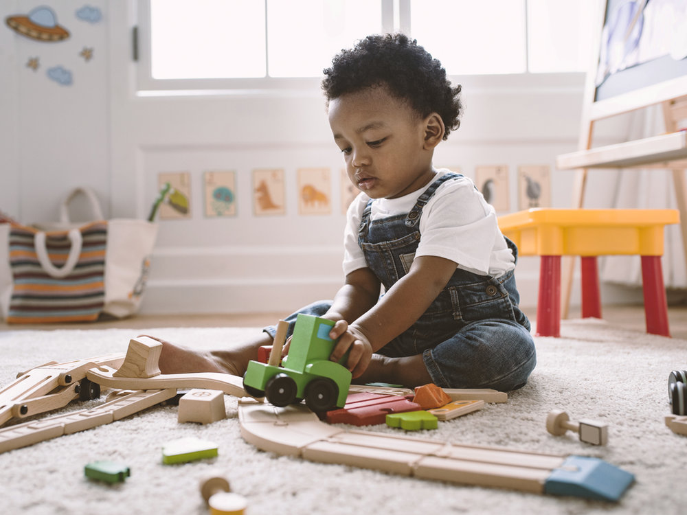 Hands-on play with wooden toys to illustrate fine-motor activities