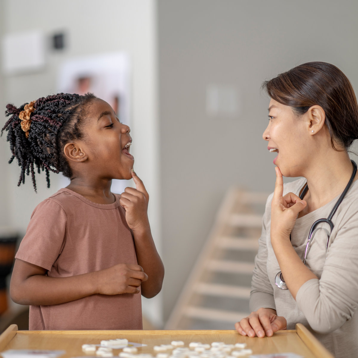 A child and therapist practicing communication through play